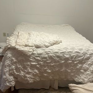 White ruffled, king duvet, and four euro shams by Anthropologie
